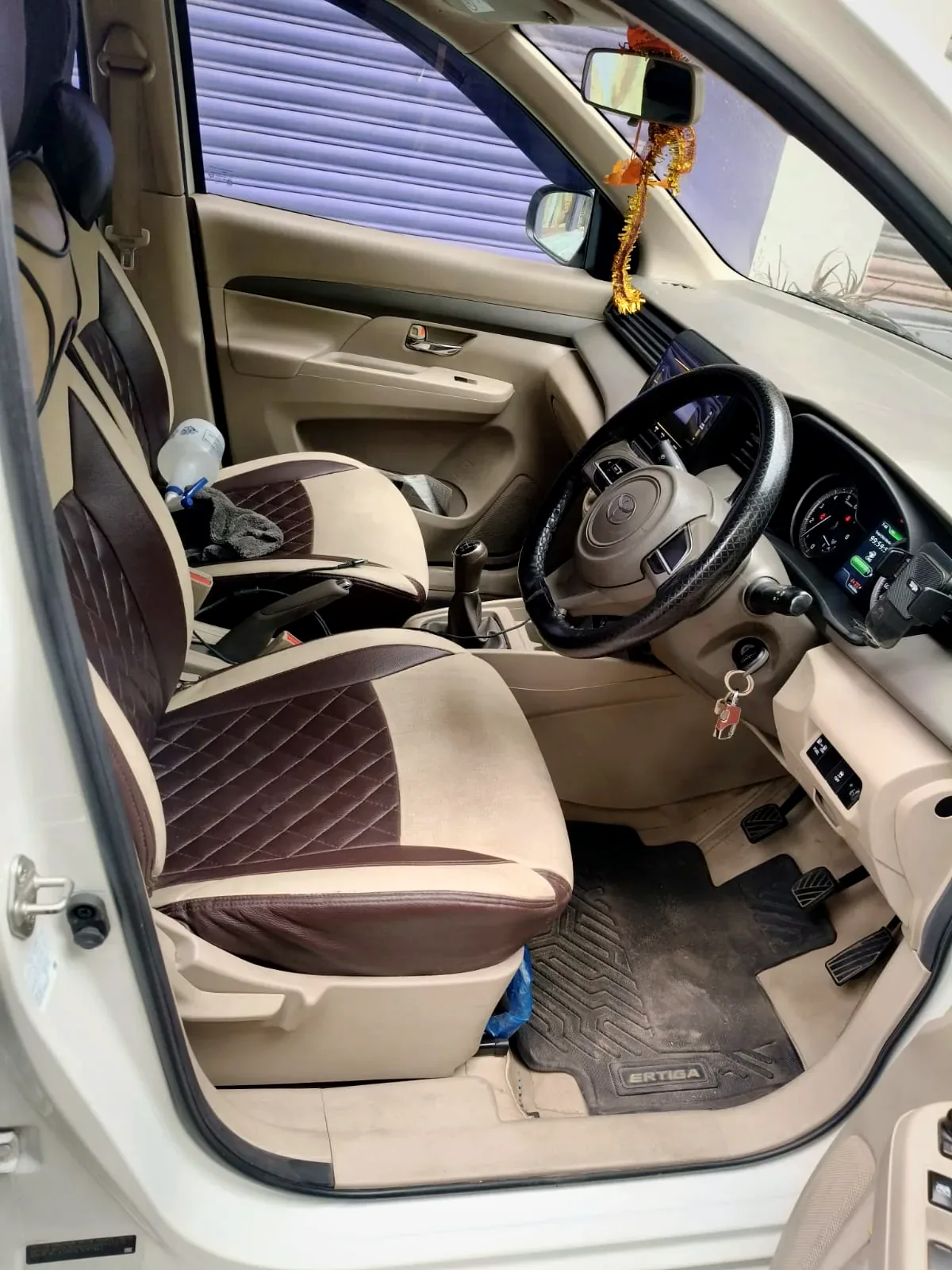 Toyota Rumion front cabin — beige seats and dashboard