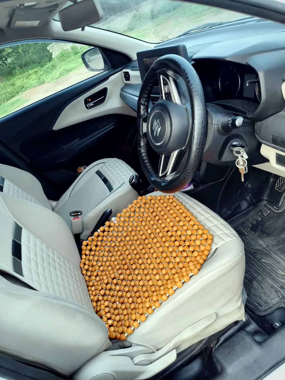Dzire front cabin — beige seats and dashboard